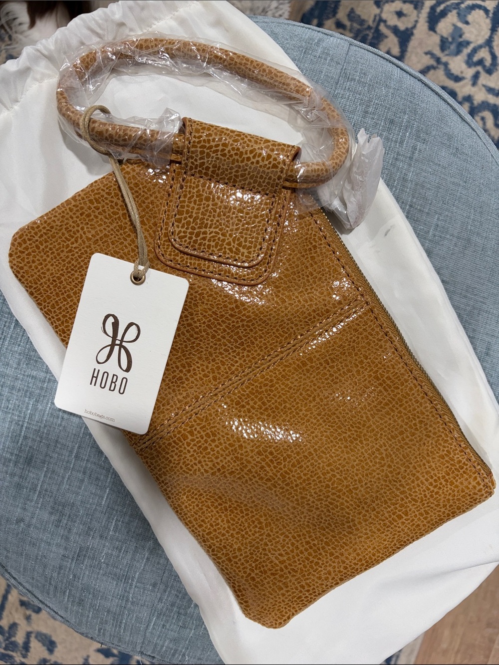 HOBO Tan Textured Patent Leather Hobo clutch